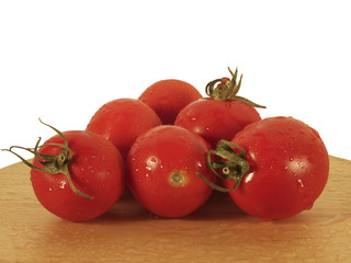 tomatoes on a wooden board