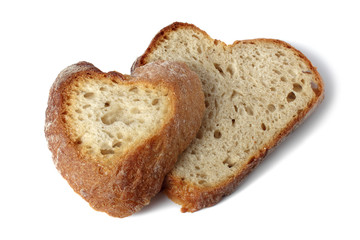 two slices of heart shaped bread isolated on white