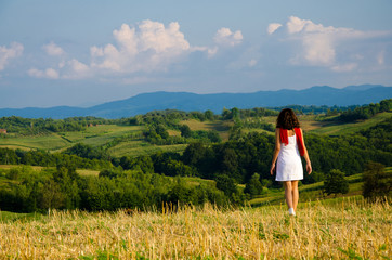 Girl goes on a field