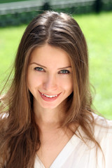 Fototapeta premium Beautiful young woman. Outdoor portrait