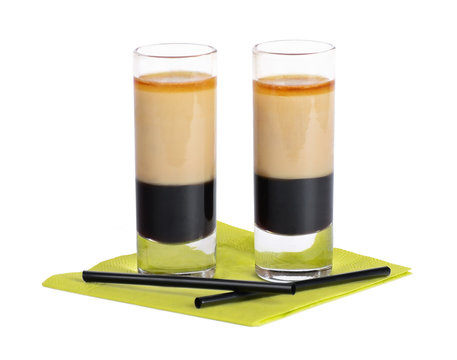 B-52 cocktail shooter, B52 or Bifi. Layered shot, composed of coffee liqueur, Irish cream, and triple sec. Ingredients separate into three distinctly visible layers due to their relative densities.