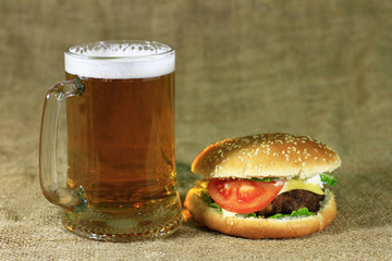 Glass of beer and  hamburger
