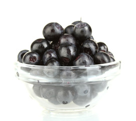 Transparent bowl with ripe blueberries isolated on white