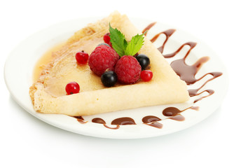 Delicious pancakes with berries,chocolate and honey