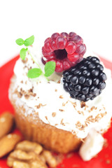 muffin with whipped cream,mint, raspberries, blackberries and nu