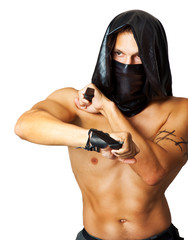 Man assassin with sexy torso in mask