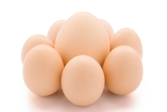 big egg surrounded by small eggs with clipping path