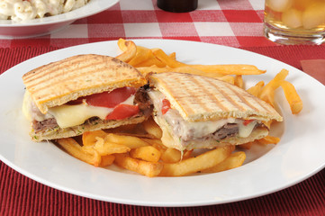 Roast beef and cheese panini on flatbread