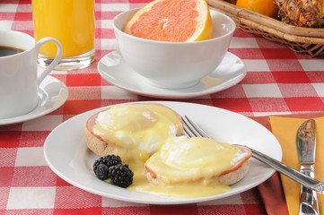 Eggs benedict with pink grapefruit