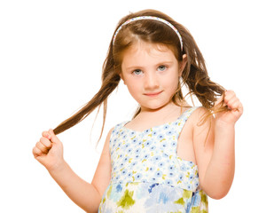 Young girl holding her long hair 
