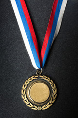 Metal medal with tricolor ribbon