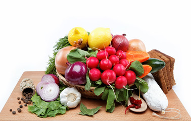 Healthy food. Fresh vegetables and fruits on a wooden board.