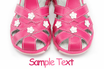 pink child's sandals isolated on white