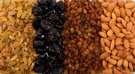 Mixed nuts and dried fruits. Almonds, raisins and prunes.