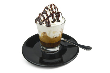 Coffee whipped cream and chocolate on the black plate