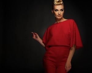 Fashionable woman in red with creative hairstyle