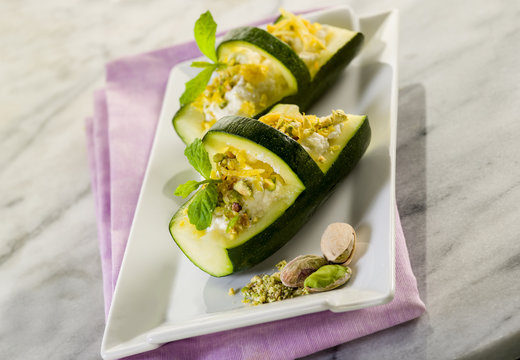 basket of stuffed zucchinis with ricotta and pistachio