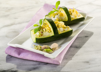 basket of stuffed zucchinis with ricotta and pistachio
