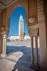 View of the Hassan II Mosque by a decorative arch © kicimici