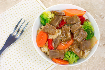 Beef teriyaki with fork and napkin