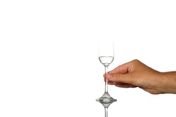 Mans hand holding liquor glass -isolated over white