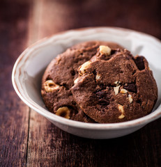 Chocolate chip cookies with hazelnuts in a bowl