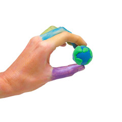 colorful paints hand holding globe made from clay as logo