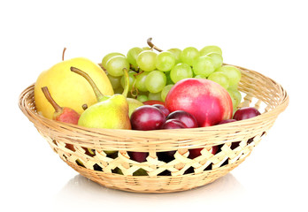 Mix of ripe sweet fruits and berries in basket isolated on