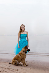 Woman and dog on the beach