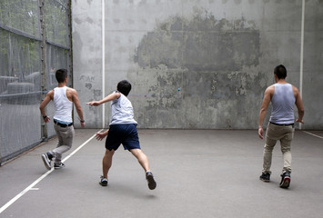 A group plays wall handball
