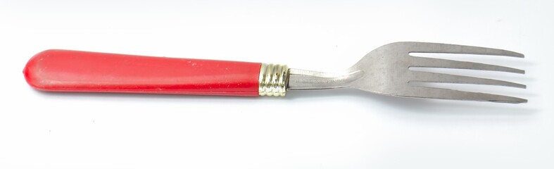 fork with red plastic handle