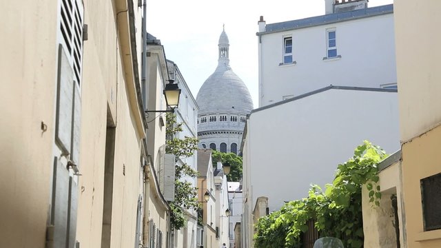 Pedestrian street of Montmartre with view on the Sacred-Heart