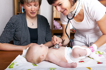 Doctor examines baby