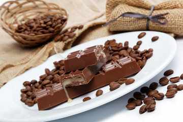 Chocolate and coffee beans on sacking.