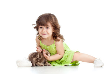 funny happy child playing with cat kitten