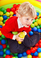 Fototapeta na wymiar Child in colored ball.