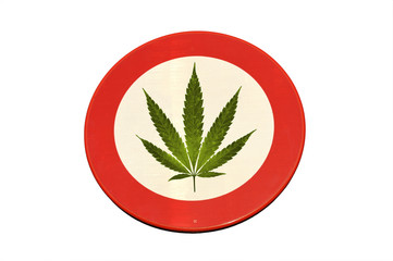 Red and white round reflective sign with canabis leaf (isolated)
