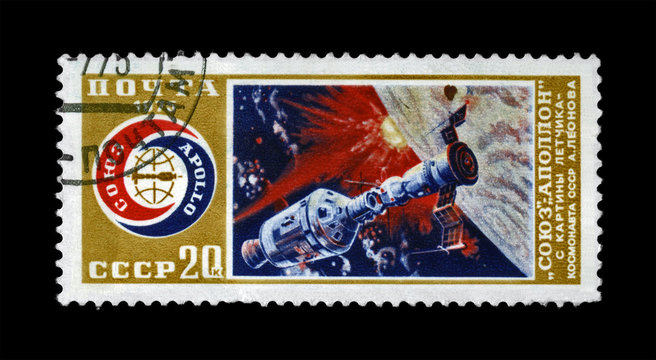 Soyuz and Apollo spaceship experimental flight,circa 1975. manned space flight near Earth Planet. Apollo-Soyuz Test Project as 1st joint flight of the USA and USSR. Stamp printed in USSR (Russia).