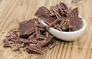 Small bowl with Chocolate on wood