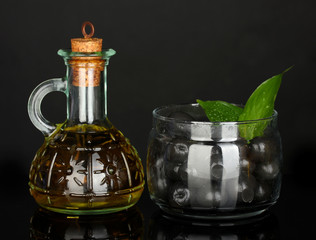 Olive oil small decanter isolated on black background