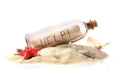 Glass bottle with note inside on sand isolated on white