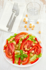 vegetable salad with chickpea on the white plate