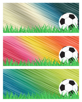 Football soccer on grass and abstract background