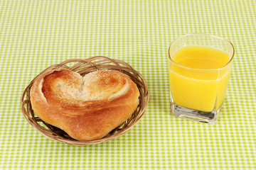 Classical breakfast. Orange juice and bun