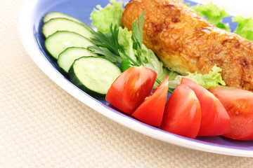 Tasty meat cutlet with garnish on plate