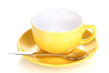 Yellow cup and saucer isolated on white
