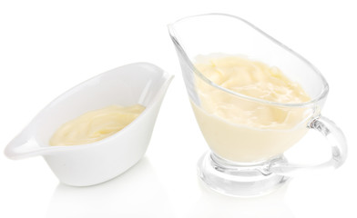Mayonnaise in bowls isolated on white
