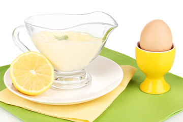 Mayonnaise in bowl on napkin isolated on white