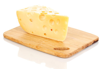 tasty cheese on wooden board isolated on white