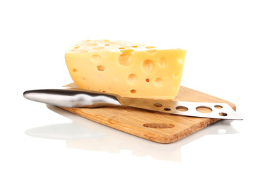 tasty cheese and knife on wooden board isolated on white